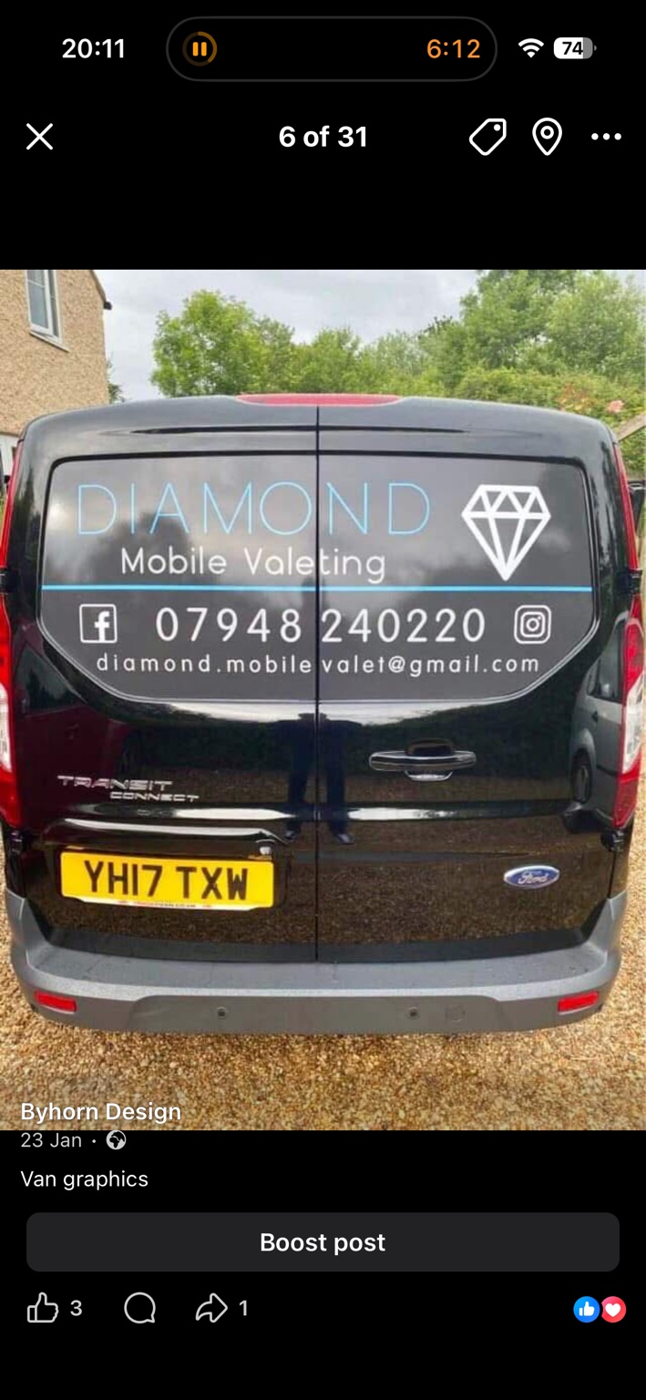 Diamond Mobile Valeting graphics across the rear doors of a black van